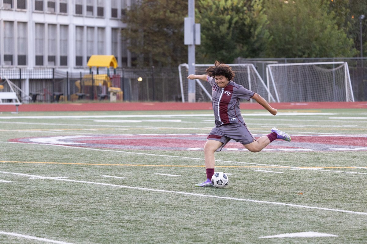 Soccer player mid-kick